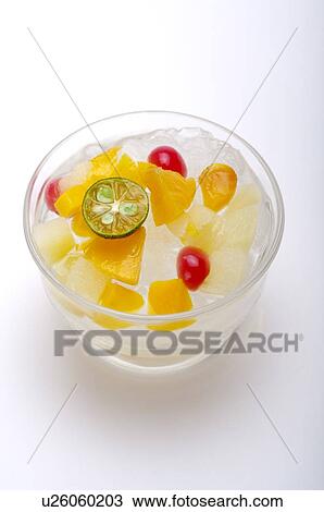 Stock Image - Canned fruit on ice. Fotosearch