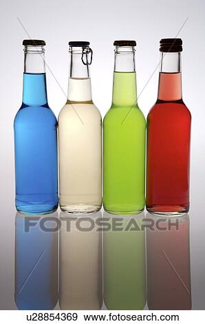 Four cocktails in glass bottles, lined up in a row View Large Photo Image Stock Photo - Four cocktails in glass bottles, lined up in a row. Fotosearch