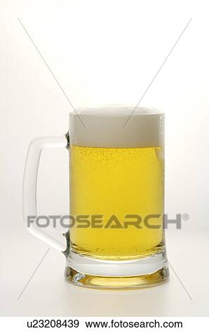 Stock Photo - Frothing beer in a beer stein. Fotosearch