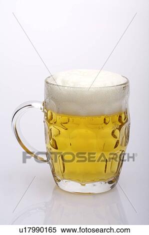 Glass of beer with froth on top, still life View Large Photo Image Stock Photography - Glass of beer with froth on top, still life. Fotosearch