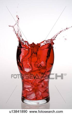 Glass of Cranberry juice, juice splashing out of the glass View Large Photo Image Stock Image - Glass of Cranberry juice, juice splashing out of the glass. Fotosearch