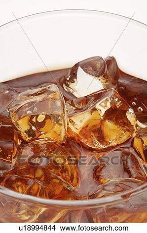 Picture - Glass of iced black tea, close-up. Fotosearch