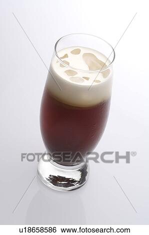 Stock Photograph - Glass of iced coffee with foam on top. Fotosearch