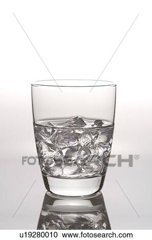 Glass of water with ice cubes, still life View Large Photo Image Stock Image - Glass of water with ice cubes, still life. Fotosearch