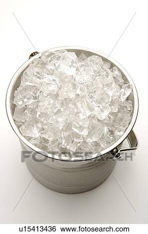 Ice bucket, filled with ice cubes View Large Photo Image Stock Photograph - Ice bucket, filled with ice cubes. Fotosearch