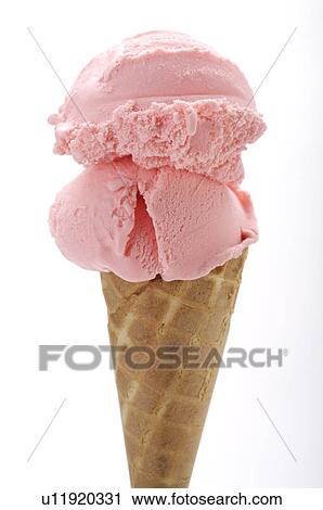 Stock Image - Two scoops of strawberry ice cream on an ice cream cone. Fotosearch