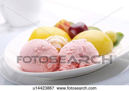 Two scoops of strawberry ice cream with fruit, arranged on a plate View Large Photo Image Stock Photo - Two scoops of strawberry ice cream with fruit, arranged on a plate. Fotosearch
