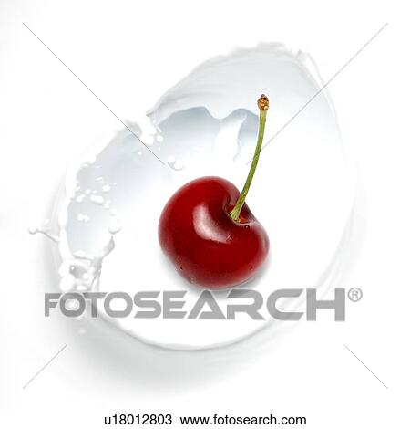 Cherry splashing into milk View Large Photo Image Stock Image - Cherry splashing into milk. Fotosearch