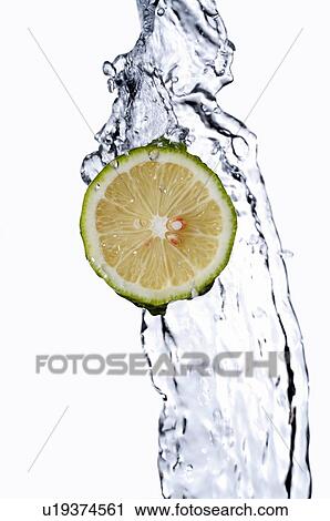 Cross-section of a lemon in front of a stream of flowing water View Large Photo Image Stock Image - Cross-section of a lemon in front of a stream of flowing water. Fotosearch