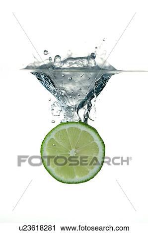 Cross-section of lemon in water, splashing the water View Large Photo Image Stock Image - Cross-section of lemon in water, splashing the water. Fotosearch