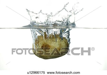 Stock Photography - Potato falling into water. Fotosearch
