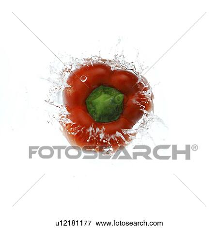 Stock Photo - Red bell pepper falling into water, high angle view. Fotosearch