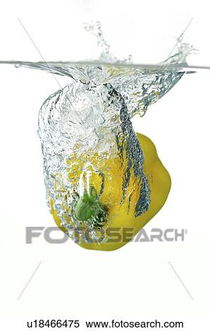 Stock Photography - Yellow pepper splashing into water. Fotosearch