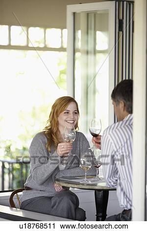 Stock Image - Couple drinking wine. Fotosearch