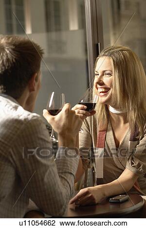 Mid adult couple drinking red wine View Large Photo Image Stock Image - Mid adult couple drinking red wine. Fotosearch