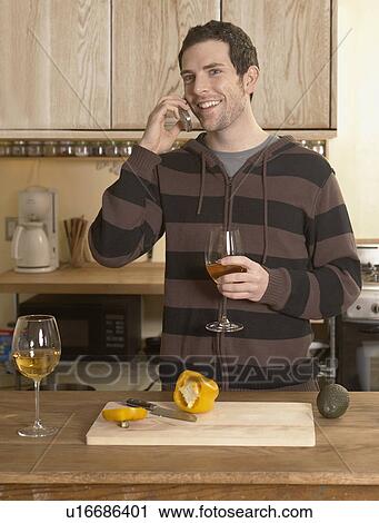 Mid-Adult Man Drinking Wine and Talking on Phone View Large Photo Image Stock Image - Mid-Adult Man Drinking Wine and Talking on Phone. Fotosearch