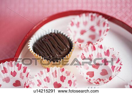 Chocolate and candy papers on plate (close-up) View Large Photo Image Stock Image - Chocolate and candy papers on plate (close-up). Fotosearch