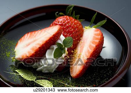 Sliced strawberries on a plate, high angle view, close up, black background, Japan View Large Photo Image Stock Image - Sliced strawberries on a plate, high angle view, close up, black background, Japan. Fotosearch