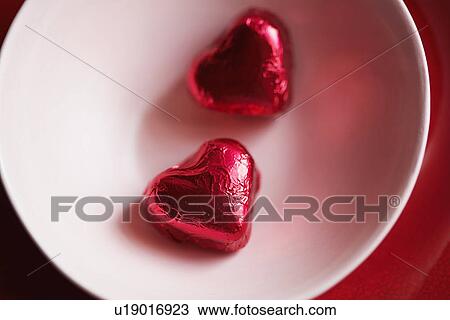 Two heart shaped candies in bowl (close-up, directly above) View Large Photo Image Stock Image - Two heart shaped candies in bowl (close-up, directly above). Fotosearch