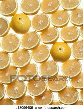 Stock Photograph - Halved Grapefruits. Fotosearch
