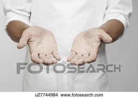Flour on chef's hand (mid section) View Large Photo Image Picture - Flour on chef's hand (mid section). Fotosearch