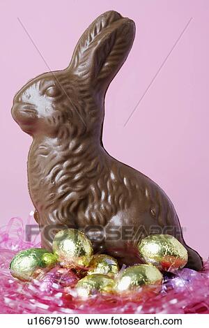 Stock Image - Chocolate Easter Bunny and Easter eggs. Fotosearch