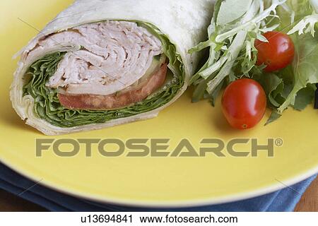 Close-up of wrap sandwich with salad View Large Photo Image Stock Image - Close-up of wrap sandwich with salad. Fotosearch