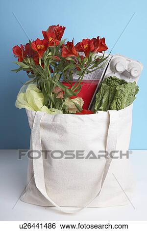 Cut flowers and vegetables in paper bag View Large Photo Image Stock Photograph - Cut flowers and vegetables in paper bag. Fotosearch