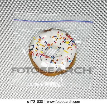 Stock Image - Doughnut in Plastic Bag. Fotosearch
