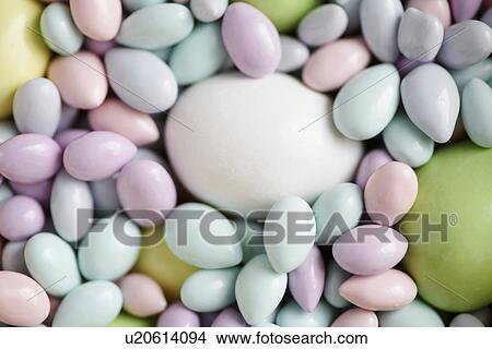 Picture - Easter eggs and candies (close-up). Fotosearch