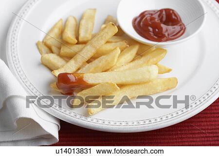 French fries and ketchup View Large Photo Image Stock Image - French fries and ketchup. Fotosearch