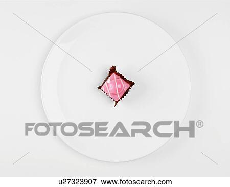 Single cake on white plate (close-up, directly above) View Large Photo Image Stock Photo - Single cake on white plate (close-up, directly above). Fotosearch