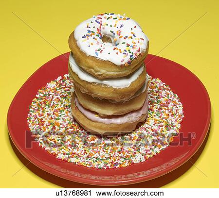Stock Image - Stack of Doughnuts on Plate. Fotosearch