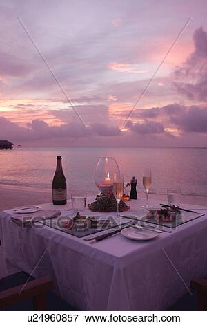 Stock Photo - Dinner With The Setting Sun. Fotosearch