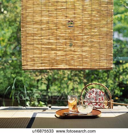 Stock Image - Drink On Verandah. Fotosearch