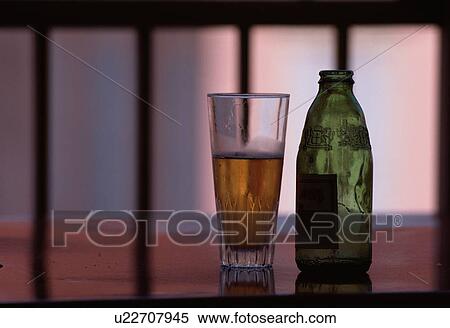 Stock Photography - Glass Of Beer Near Bottle. Fotosearch