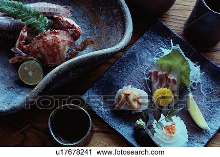 Stock Image - Sashimi And Crab On Plates. Fotosearch