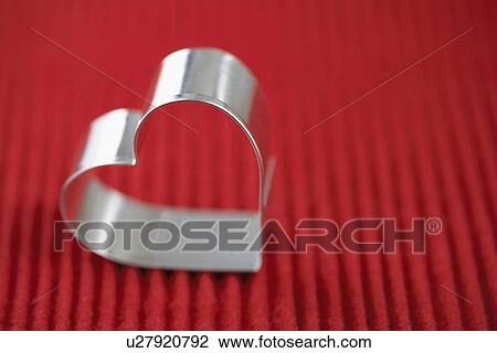 Stock Image - Heart shaped cookie cutter (close-up). Fotosearch