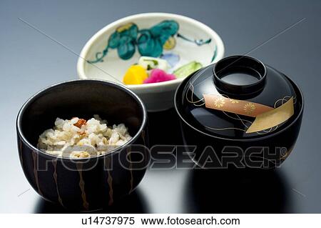 Stock Photography - Japanese soup, rice and pickles, high angle view, black background, Japan. Fotosearch
