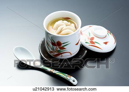 Stock Image - Steamed egg hotchpotch with milt on the top, high angle view, black background, Japan. Fotosearch