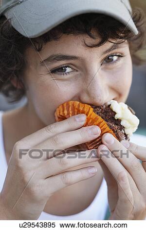 Teenage girl eating cake View Large Photo Image Stock Photography - Teenage girl eating cake. Fotosearch