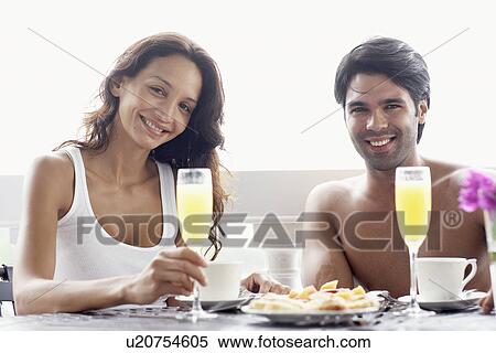 Young couple having breakfast View Large Photo Image Stock Photography - Young couple having breakfast. Fotosearch