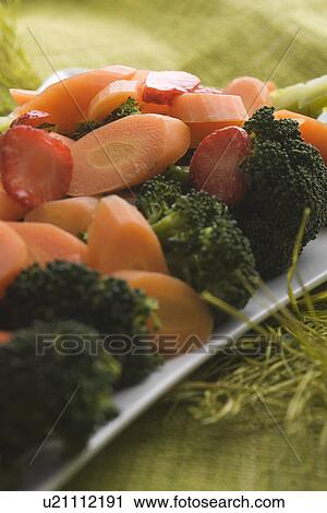 Stock Image - Broccoli, Carrot, Close-Up, Indoors. Fotosearch