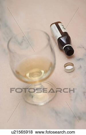 Stock Photo - wine, bottle, cold, pale yellow, drinking glass. Fotosearch
