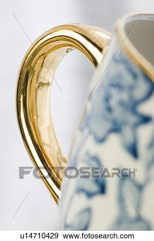 Stock Photo - Blue, Cup, Extreme Close-Up, Focus On Background, Golden. Fotosearch