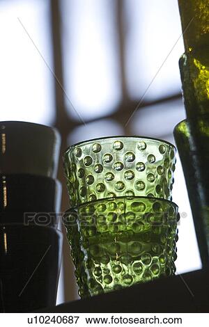 Stock Photo - Close-Up, Focus On Foreground, Glass, Green, Half Full. Fotosearch