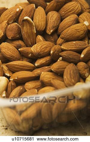 Stock Image - Bowl, Dried Fruit, Close-Up, Brown, Almond. Fotosearch