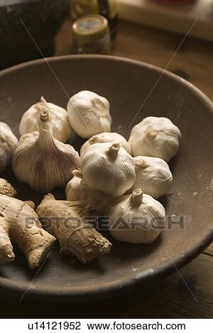 Stock Image - Bowl, Garlic, Ginger, Indoors. Fotosearch