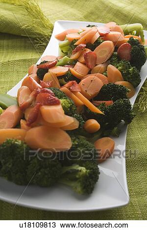 Stock Image - Broccoli, Carrot, Close-Up, Indoors. Fotosearch