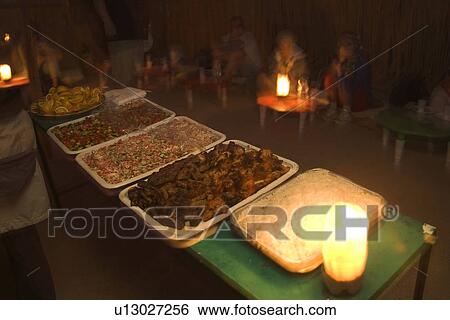 Stock Photograph - Casual Clothing, Close-Up, Eating, Focus On Foreground, Food. Fotosearch